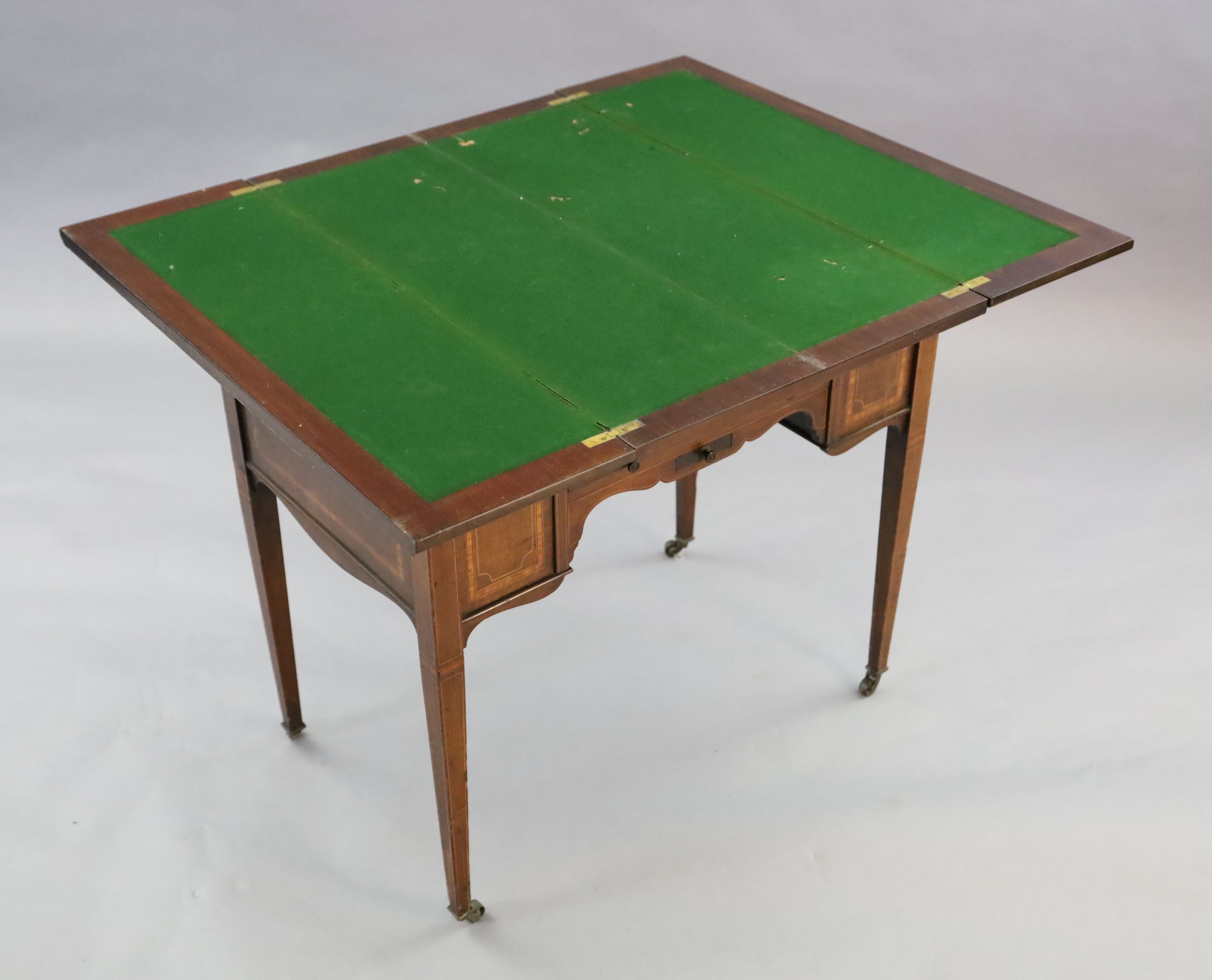 An Edwardian satinwood banded mahogany games/drinks table,
